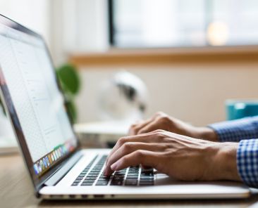hands-typing-on-laptop