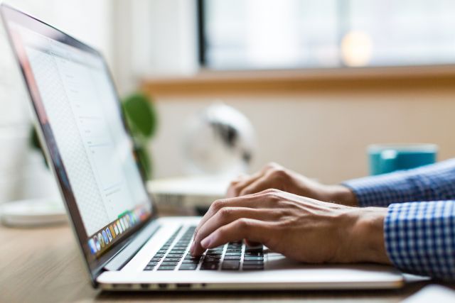 hands-typing-on-laptop